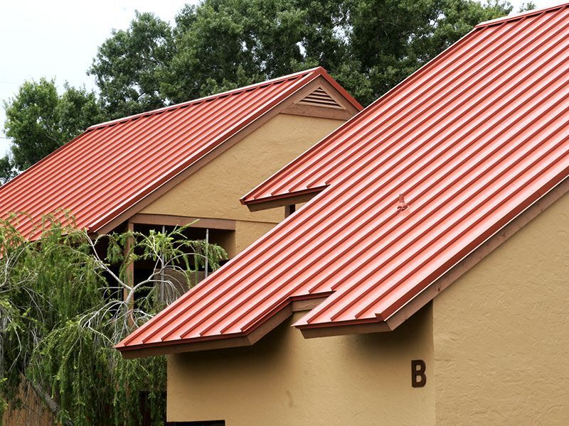 Florida Southern Roofing employees on site during a commercial roof repair. Commercial roof replacement services in Sarasota, FL Florida Southern Roofing And SheetMetal 