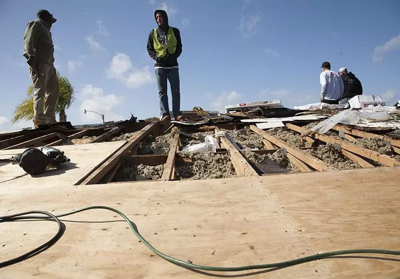 Florida Southern Roofing employees working on the first Roofs for Heroes project