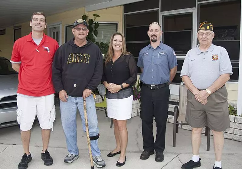 Mr. Harris with Cindi Bass of Florida Southern Roofing and some of our business partners in the 2016 Roofs for Heroes project.